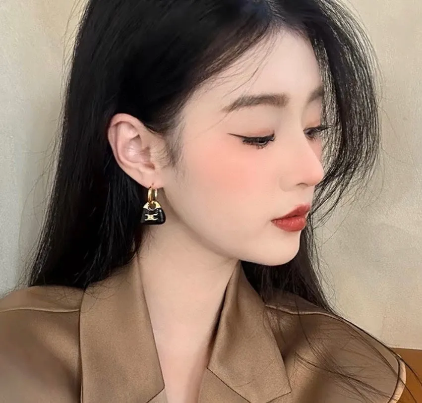 Celine's new black enamel personalized bag with gold earrings EHA101