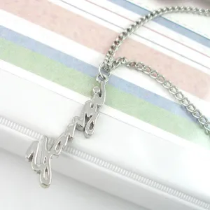 Silver Tone Fashion Necklace with Abstract Script Pendant
